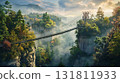 Long suspension bridge crossing a misty canyon overgrown with dense evergreen and deciduous trees 131811933