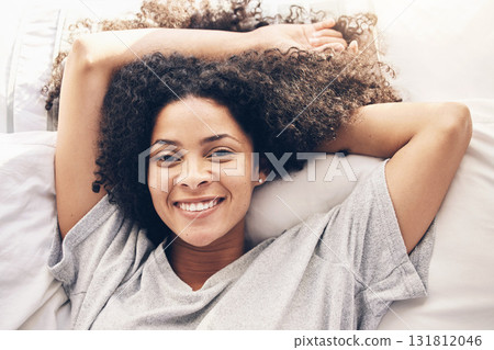 Black woman, top view and wake up portrait in bedroom after sleeping in the morning. Peace, bed relax and comfort of happy female awake after sleep on comfortable pillow and blankets for healthy rest 131812046