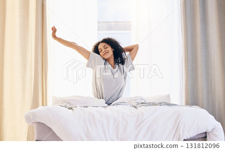 Morning stretching, black woman and wake up in home bedroom after sleeping or resting. Relax, peace and comfort of happy female stretch after sleep feeling fresh, awake and well rested in house. Morning stretching, black woman and wake up in home bedroom after sleeping or resting. Relax, peace and comfort of happy female stretch after sleep feeling fresh, awake and well rested in house. 131812096