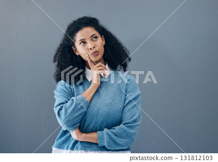 Thinking, ponder and woman in a studio contemplating a question or plan in her head. Wondering, pensive and female model from Mexico brainstorming while isolated by gray background with mockup space. 131812103