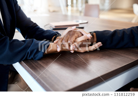 Love, comfort and hands of couple in support of bad news, cancer or diagnosis at a table, unity and trust. Hand, holding empathy by woman with man for depression, prayer and kindness during crisis 131812259