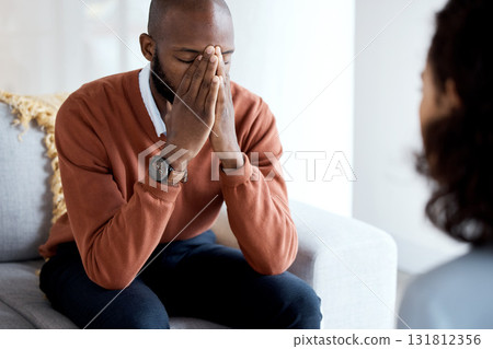 Black man, mental health and depression counseling and psychologist, stress headache and help. Psychology consultation, woman doctor with depressed patient and conversation about anxiety problem 131812356