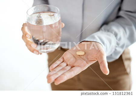 Pills, water glass and woman hands for mental health, depression or medical problem in pharmaceutical industry. Medicine, tablet or healthcare drugs of person anxiety, headache and stress management 131812361