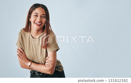 Portrait, mockup and laughter with an arms crossed woman in studio having fun on a gray background. Comic, comedy and humor with an attractive young female standing indoor feeling playful or carefree Portrait, mockup and laughter with an arms crossed woman in studio having fun on a gray background. Comic, comedy and humor with an attractive young female standing indoor feeling playful or carefree 131812382
