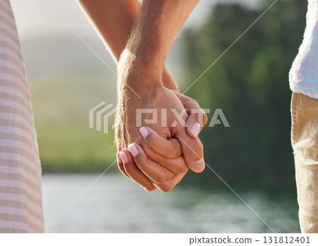 Holding hands, love and couple at lake outdoors for commitment, trust and support. Romantic date, care and woman and man together for romance, bonding and affection with soulmate at creek on vacation Holding hands, love and couple at lake outdoors for commitment, trust and support. Romantic date, care and woman and man together for romance, bonding and affection with soulmate at creek on vacation 131812401