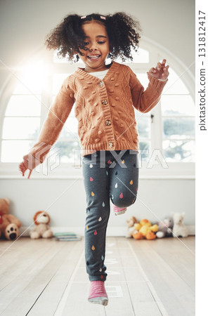 Hopscotch, happy and girl play in bedroom having fun, enjoying games and relax on weekend. Childhood, kindergarten and excited girl in bedroom for jumping game, playing and numbers activity on floor Hopscotch, happy and girl play in bedroom having fun, enjoying games and relax on weekend. Childhood, kindergarten and excited girl in bedroom for jumping game, playing and numbers activity on floor 131812417