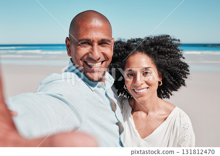 Couple, smile and selfie portrait at beach on vacation, bonding and care at seashore. Holiday love, summer ocean and man and woman taking pictures for social media, profile picture or happy memory. 131812470