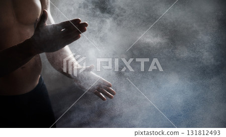 Magnesium, chalk and bodybuilder hands preparing for a workout or weight training at the gym. Fitness, talc and male athlete getting ready for bodybuilding exercise in sports center with mockup space Magnesium, chalk and bodybuilder hands preparing for a workout or weight training at the gym. Fitness, talc and male athlete getting ready for bodybuilding exercise in sports center with mockup space 131812493