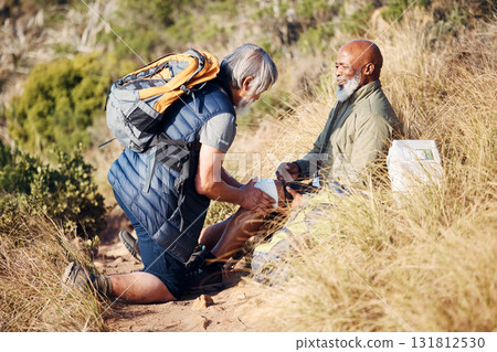 First aid, injury and knee pain with old men in nature for trekking, adventure and fitness. Help, bandage and medical with friends and leg accident on trail for backpacking, discovery and emergency First aid, injury and knee pain with old men in nature for trekking, adventure and fitness. Help, bandage and medical with friends and leg accident on trail for backpacking, discovery and emergency 131812530