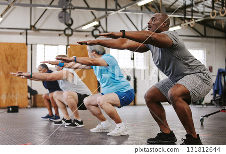 People, fitness and stretching in class at gym for workout, squat exercise or training together. Diverse group or team in warm up stretch session for sports, health and cardio wellness at gymnasium People, fitness and stretching in class at gym for workout, squat exercise or training together. Diverse group or team in warm up stretch session for sports, health and cardio wellness at gymnasium 131812644