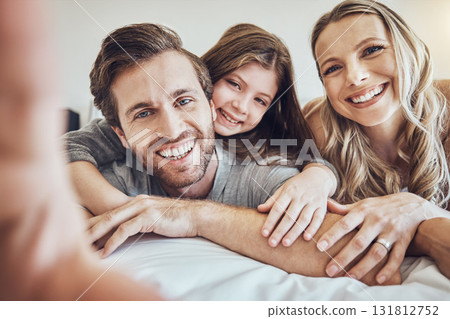 Portrait, smile or parents take a selfie with a girl as a happy family in house bedroom bonding in Berlin. Mother, father or child relaxing together enjoying quality time or taking pictures at home Portrait, smile or parents take a selfie with a girl as a happy family in house bedroom bonding in Berlin. Mother, father or child relaxing together enjoying quality time or taking pictures at home 131812752