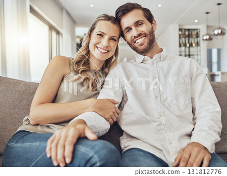 Couple. portrait and home of young people together on a living room couch with love and care. Happiness, smile and hug of a man and woman on a sofa feeling relax in a house lounge with marriage Couple. portrait and home of young people together on a living room couch with love and care. Happiness, smile and hug of a man and woman on a sofa feeling relax in a house lounge with marriage 131812776