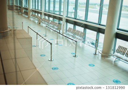 Travel, empty and floor of an airport building with space, architecture and waiting room for a plane. Design, clean and terminal for a check in while traveling, tourism and corridor entrance 131812990
