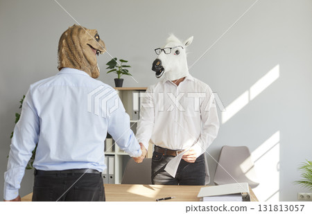 Happy colleagues shaking hands at meeting at office, celebrating success or business achievement Happy colleagues shaking hands at meeting at office, celebrating success or business achievement 131813057