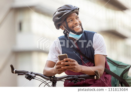 Courier service, delivery and black man with smartphone, shipping app with happy employee outdoor. Eco friendly travel, outdoor and communication with ecommerce and bike, retail and distribution 131813084