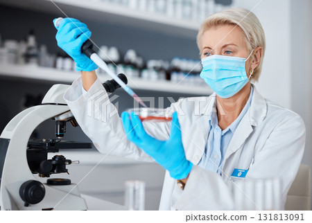 Woman, doctor and pipette in experiment with mask or gloves for safety, sample or testing in scientific research at lab. Female scientist or medical expert working with chemical in science laboratory Woman, doctor and pipette in experiment with mask or gloves for safety, sample or testing in scientific research at lab. Female scientist or medical expert working with chemical in science laboratory 131813091