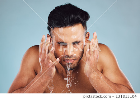 Man, water and hands in face wash for skincare, fresh clean hygiene or grooming against studio background. Young male model in beauty, wellness and washing, cleaning or cleansing for facial treatment Man, water and hands in face wash for skincare, fresh clean hygiene or grooming against studio background. Young male model in beauty, wellness and washing, cleaning or cleansing for facial treatment 131813104