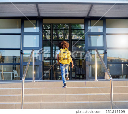 Child, walking and school entrance for education, learning or childhood development at academy building. Kid having a walk up the steps ready for back to school morning with backpack for knowledge Child, walking and school entrance for education, learning or childhood development at academy building. Kid having a walk up the steps ready for back to school morning with backpack for knowledge 131813109