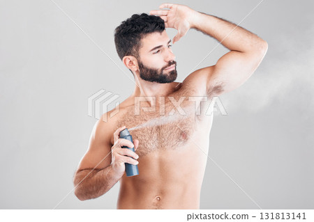 Spray, deodorant and man with cosmetics, morning routine or grooming on grey studio background. Male, perfume or fragrance for fresh scent, self care or hygiene with guy or antiperspirant on backdrop Spray, deodorant and man with cosmetics, morning routine or grooming on grey studio background. Male, perfume or fragrance for fresh scent, self care or hygiene with guy or antiperspirant on backdrop 131813141