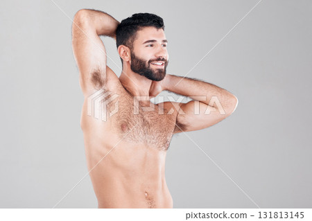 Fitness, muscles and sexy man in a studio after a bodybuilding workout or sport training. Health, wellness and muscular male model flexing his biceps while posing isolated by a gray background. Fitness, muscles and sexy man in a studio after a bodybuilding workout or sport training. Health, wellness and muscular male model flexing his biceps while posing isolated by a gray background. 131813145
