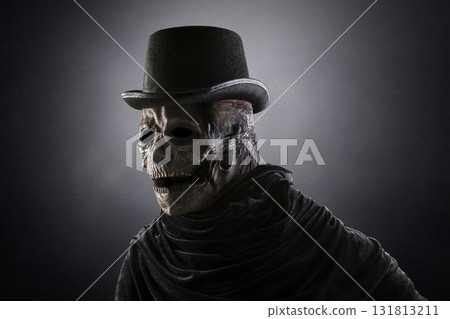 Creepy figure with black vintage top hat in the dark Creepy figure with black vintage top hat in the dark 131813211