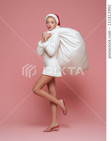 Female model in white Santa costume | Cute and sophisticated white Christmas fashion image Female model in white Santa costume | Cute and sophisticated white Christmas fashion image 131813992