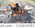 Burning a broken hoe handle to replace it 131814583