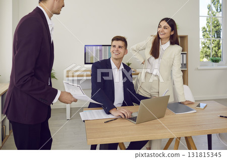 Business people at work in office on workplace. Company employees analyzing company on meeting. Business people at work in office on workplace. Company employees analyzing company on meeting. 131815345