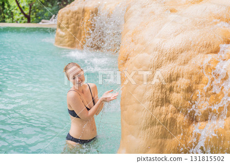 Female tourist exploring Grutas Tolantongo in Mexico, enjoying natural hot springs, scenic caves, and outdoor adventure. Travel, wellness, and sightseeing concept Female tourist exploring Grutas Tolantongo in Mexico, enjoying natural hot springs, scenic caves, and outdoor adventure. Travel, wellness, and sightseeing concept 131815502