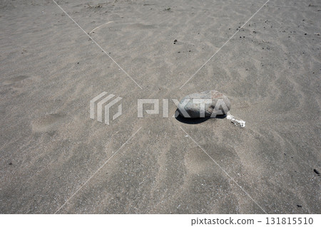 Ripples and stones on the beach Ripples and stones on the beach 131815510