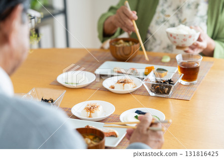 Senior couple eating breakfast Senior couple eating breakfast 131816425