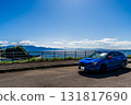 A blue car parked in a parking space by the sea. Autumn, October, Hokkaido 131817690