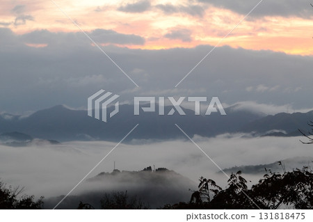 Mountain range surrounded by a sea of clouds Mountain range surrounded by a sea of clouds 131818475