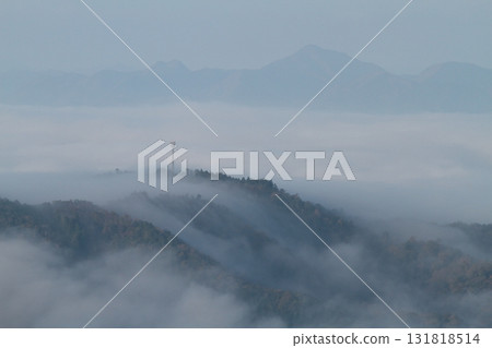 A mountain floating in the sea of clouds A mountain floating in the sea of clouds 131818514