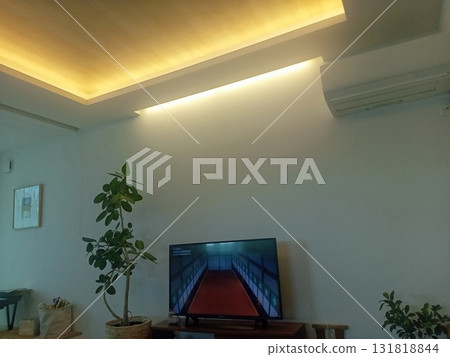 Living in a newly built living room with indirect lighting Living in a newly built living room with indirect lighting 131818844