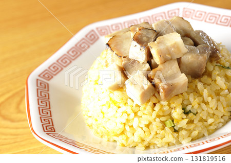 Egg fried rice topped with diced pork Egg fried rice topped with diced pork 131819516