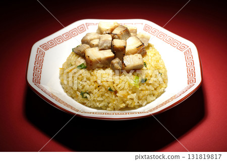 Egg fried rice topped with diced pork 131819817
