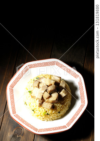 Egg fried rice topped with diced pork 131819880