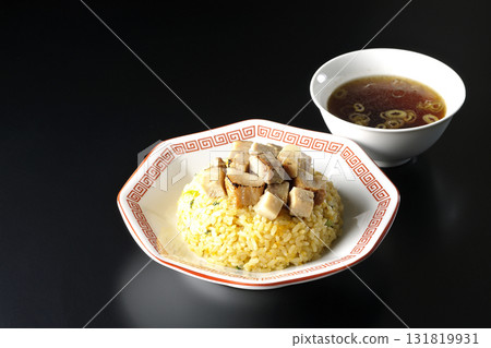 Egg fried rice topped with diced pork and Chinese soup Egg fried rice topped with diced pork and Chinese soup 131819931