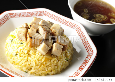 Egg fried rice topped with diced pork and Chinese soup 131819933