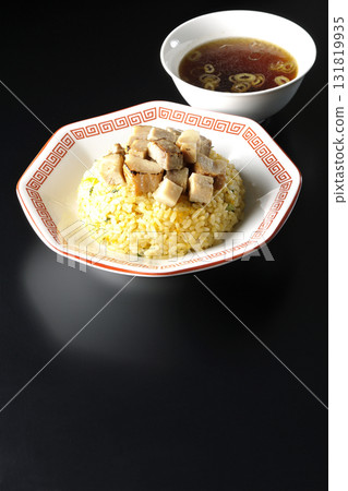 Egg fried rice topped with diced pork and Chinese soup 131819935