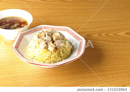 Egg fried rice topped with diced pork and Chinese soup 131819964