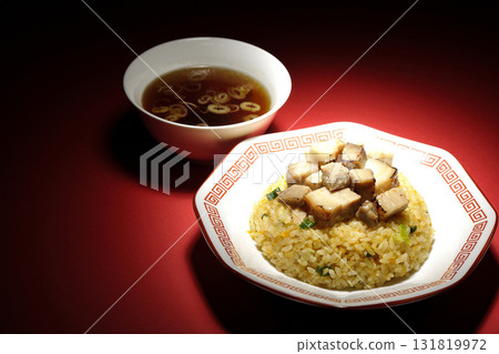 Egg fried rice topped with diced pork and Chinese soup 131819972