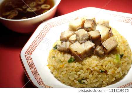 Egg fried rice topped with diced pork and Chinese soup Egg fried rice topped with diced pork and Chinese soup 131819975