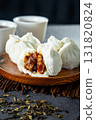 a traditional Hong Kong teahouse featuring classic dim sum delights like char siu bao and a warm cup of Chinese tea 131820824