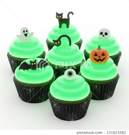 Halloween Themed Green Frosted Cupcakes with Holiday Charms on White Background Halloween Themed Green Frosted Cupcakes with Holiday Charms on White Background 131821082