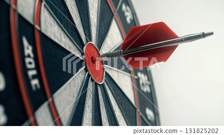 Precision targeting with red dart hitting the bullseye on a classic dartboard in a well-lit room 131825202