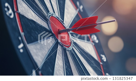 Dartboard with a red dart striking the bullseye showcasing precision at a game night Dartboard with a red dart striking the bullseye showcasing precision at a game night 131825347