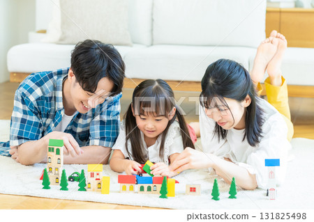 Families playing in the living room Families playing in the living room 131825498