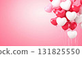 Colorful heart-shaped balloons create a festive atmosphere for a celebration in a pink setting 131825550